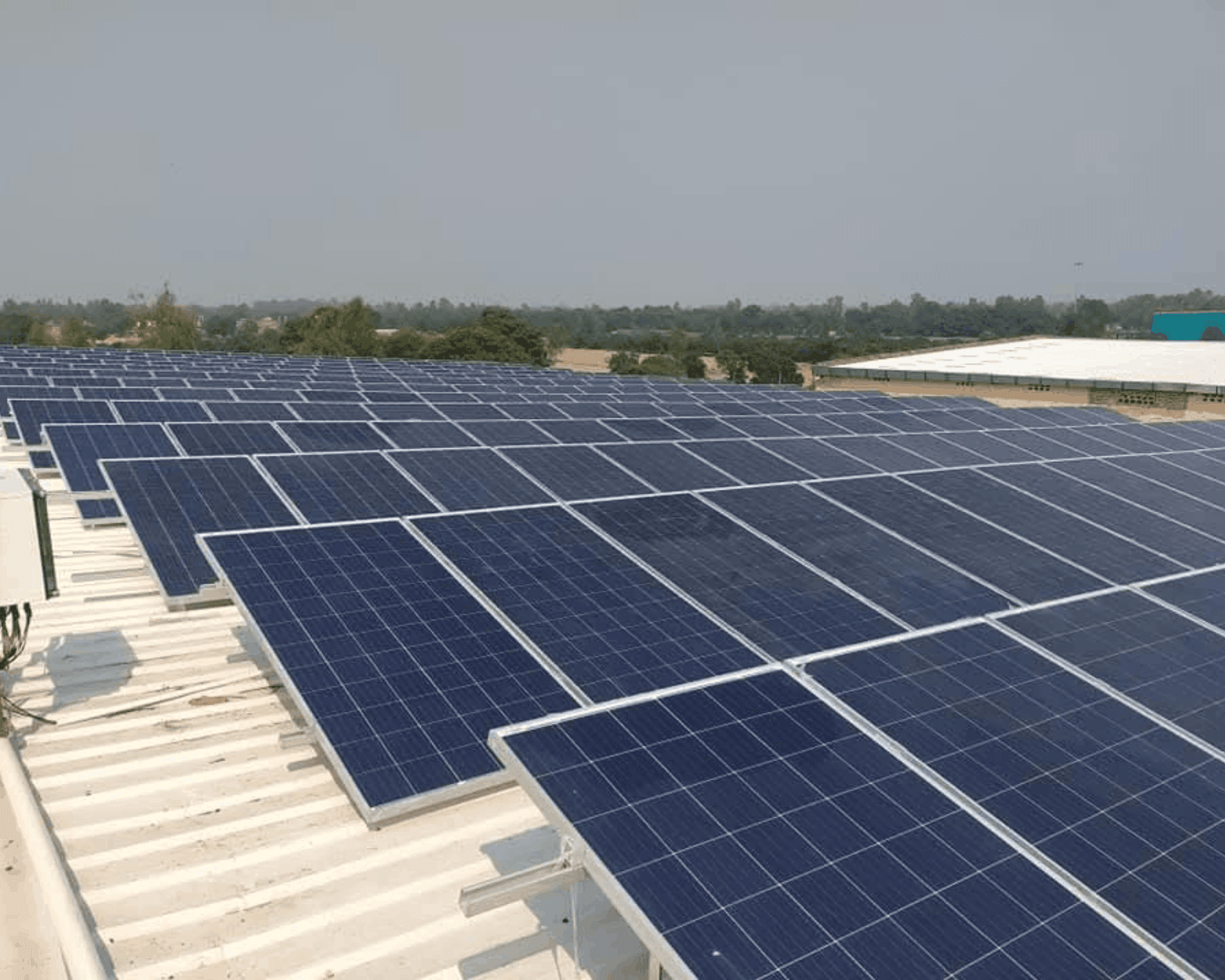 Solar panel array with mounting structure installed on sloped roof in Sohna Road, Gurgaon