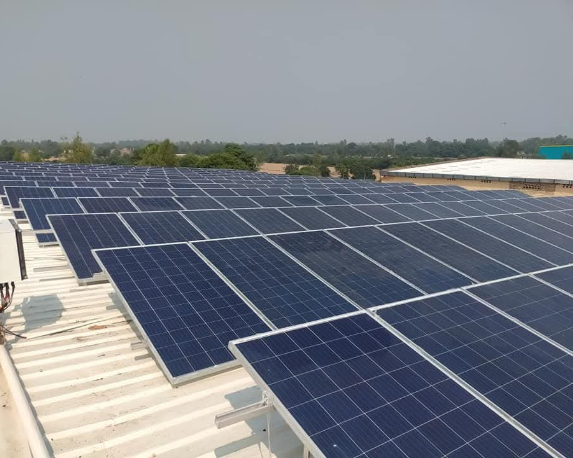 Solar panel array with mounting structure installed on sloped roof in Sohna Road, Gurgaon